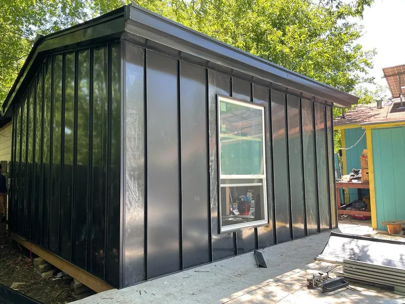 Black standing seam metal wall panels for Roof Inspection in Noblesville