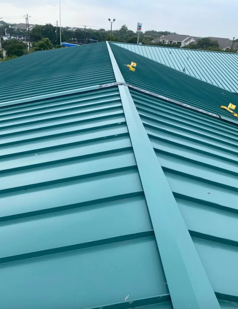Green commercial metal roof ridge and valley for Metal Roof Repair in Noblesville