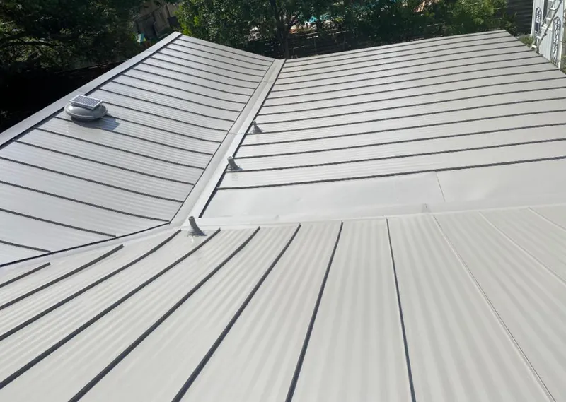Solar attic fan installed on a metal roof for Roof Ventilation in Noblesville